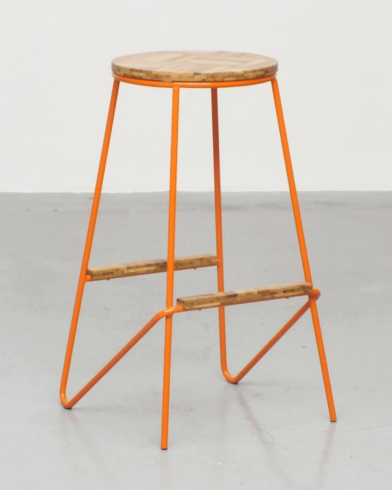 a one-of-a-kind high stool crafted from salvaged steel and reclaimed oak parquet